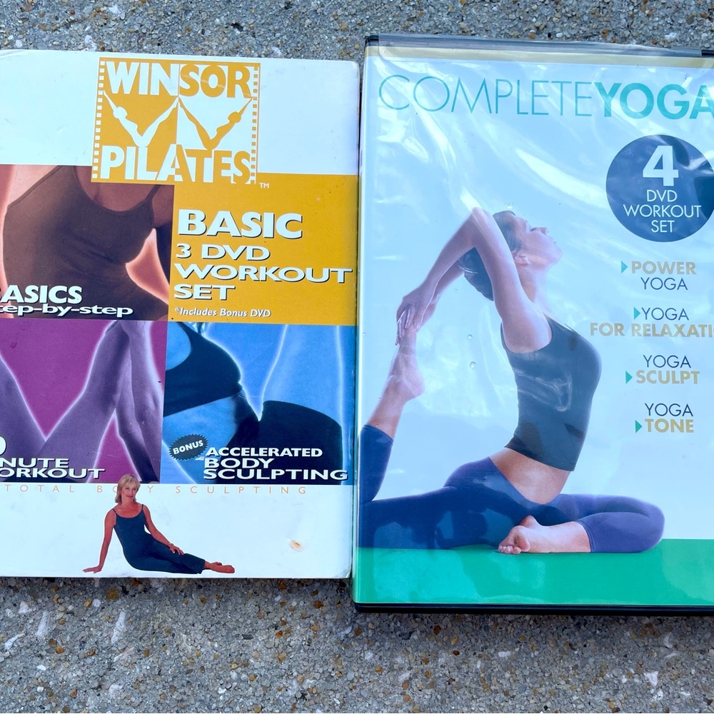 Two dvd sets one Pilates and one yoga